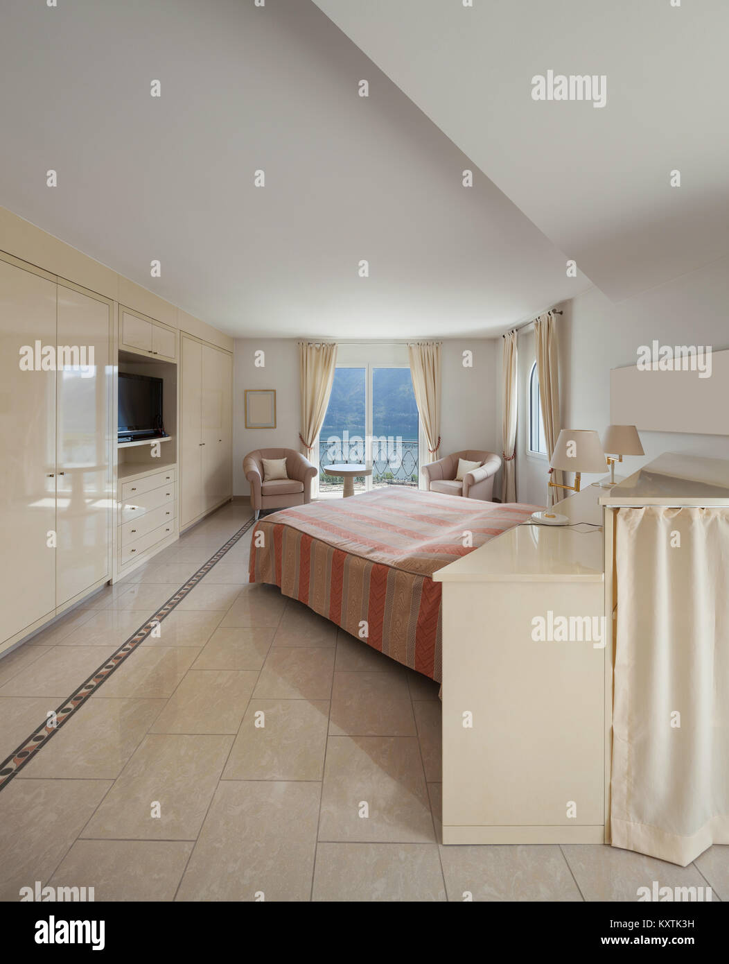 Interior of a luxury home, comfortable bedroom Stock Photo