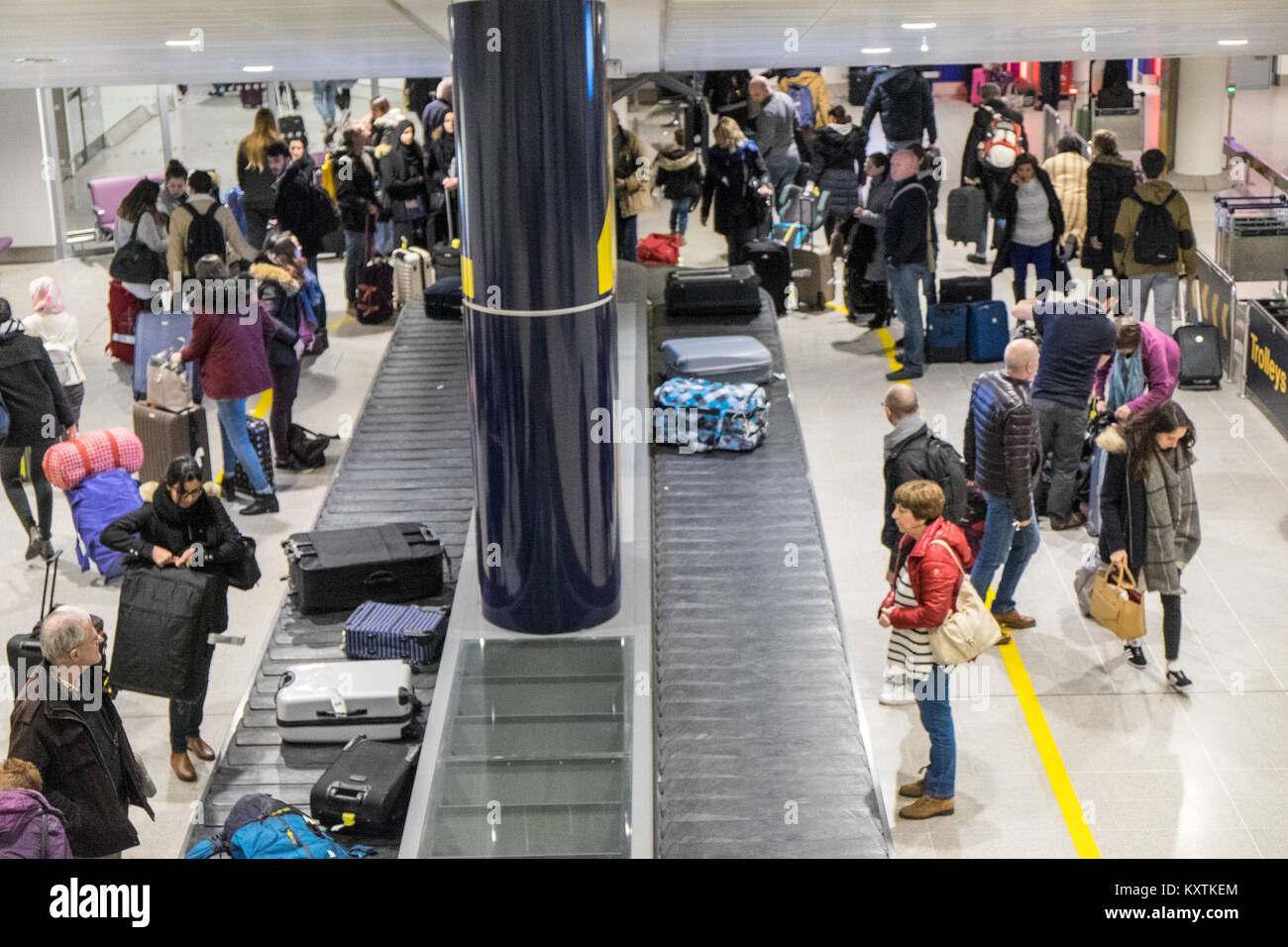Baggage luggage claim area carousel conveyor belt hires stock