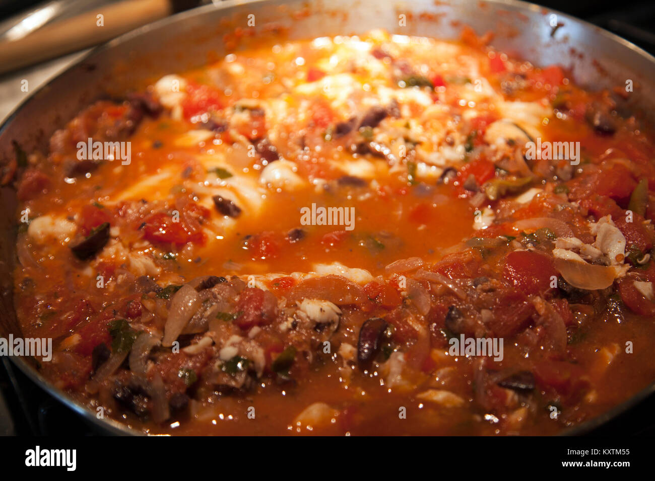 Fish in Tomato based Sauce Stock Photo Alamy