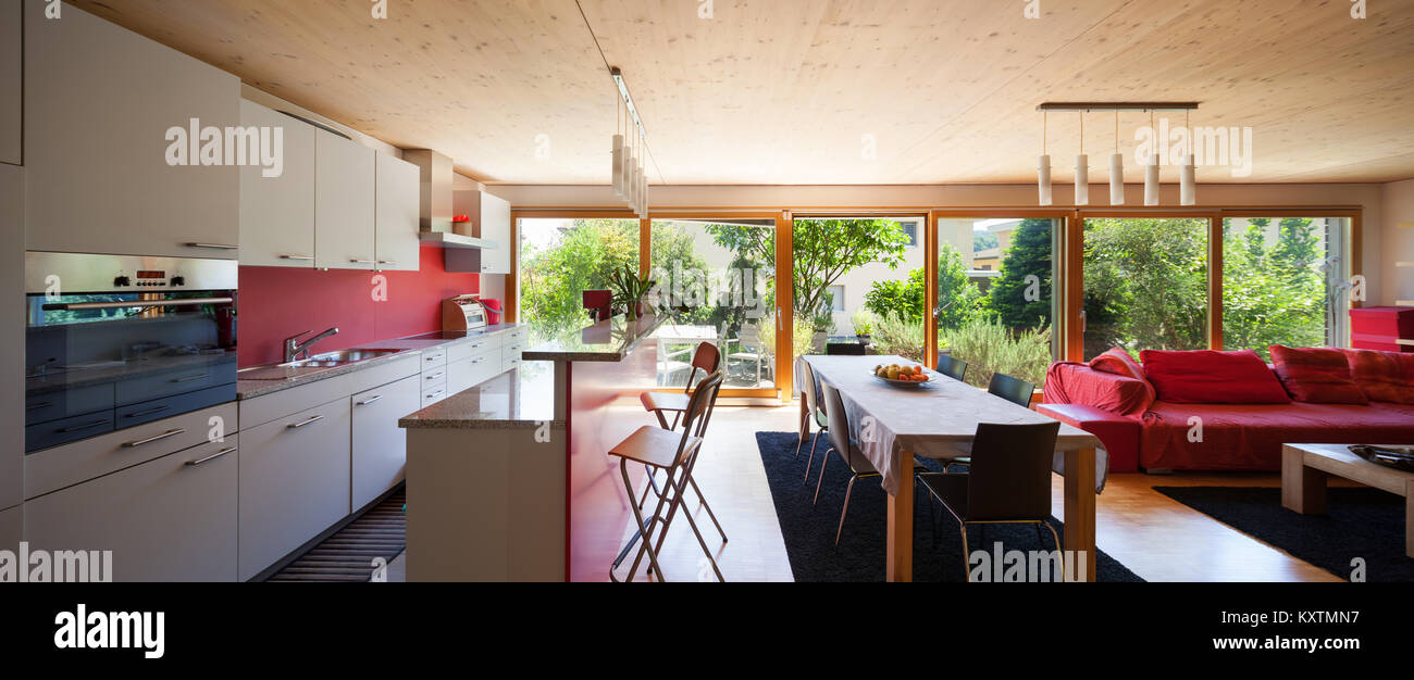 open space of a modern house, dining table and kitchen Stock Photo - Alamy