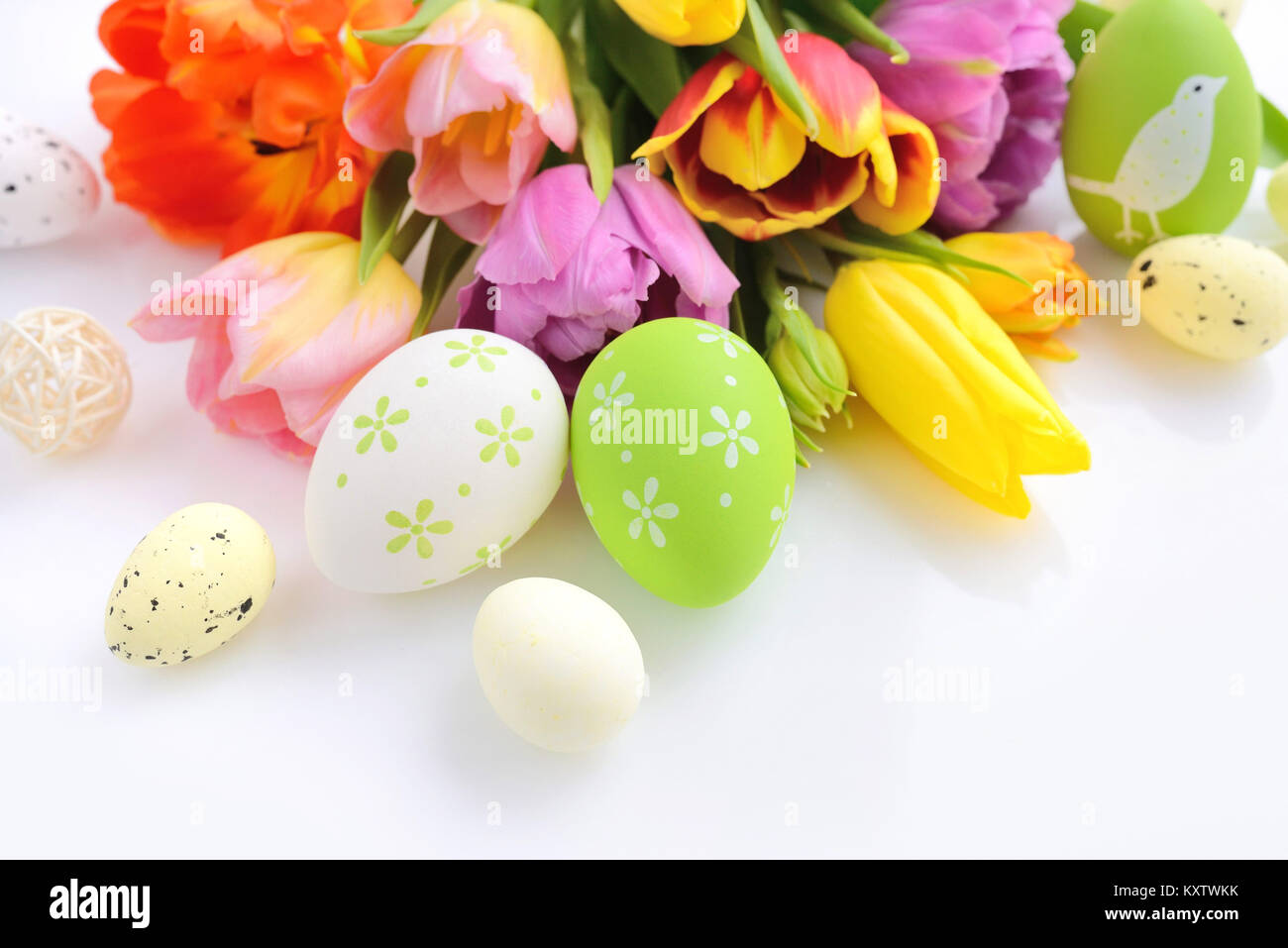 Easter eggs with tulips flowers on white background Stock Photo - Alamy