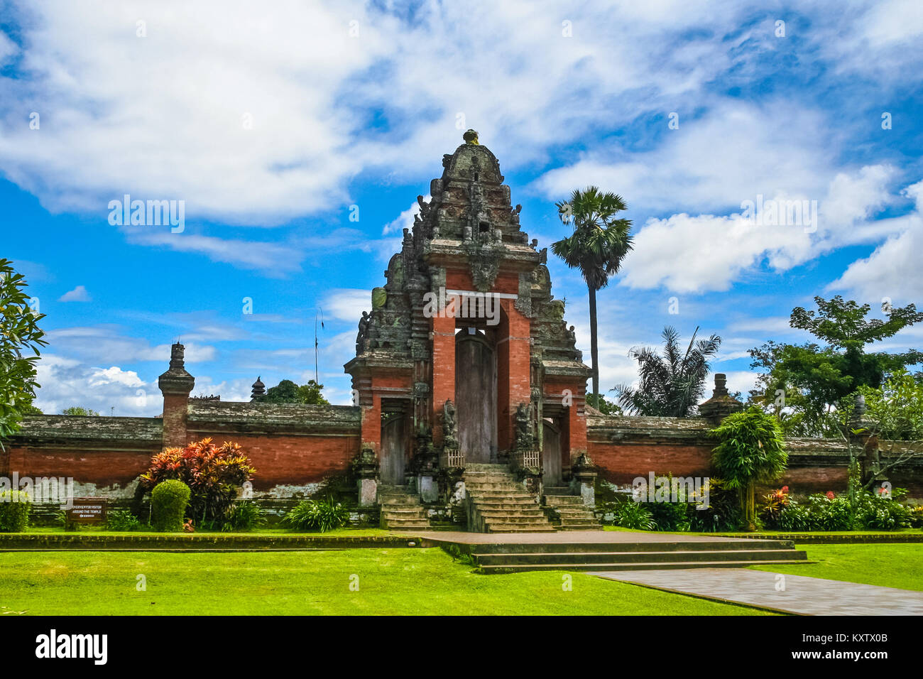 A roofed tower gate (kori agung), which is the entrance to the temple's inner sanctum of Pura Taman Ayun in Mengwi, Bali, Indonesia. Stock Photo
