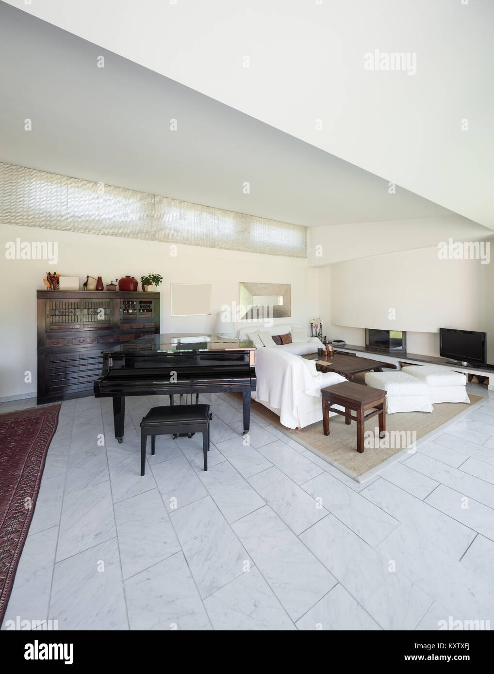 living room with piano of a modern house, interior Stock Photo - Alamy