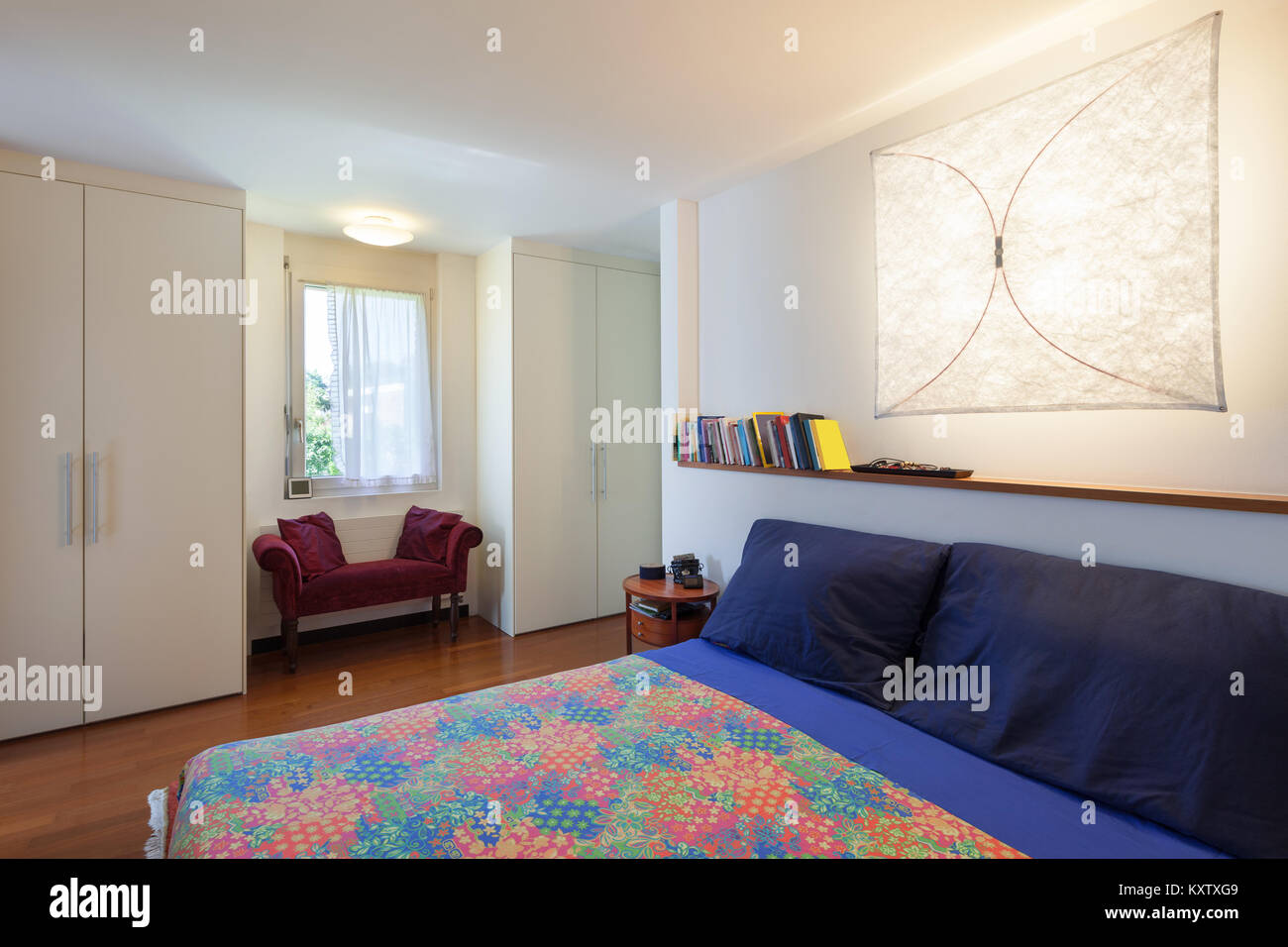 bedroom with double bed of a modern house, interior Stock Photo - Alamy