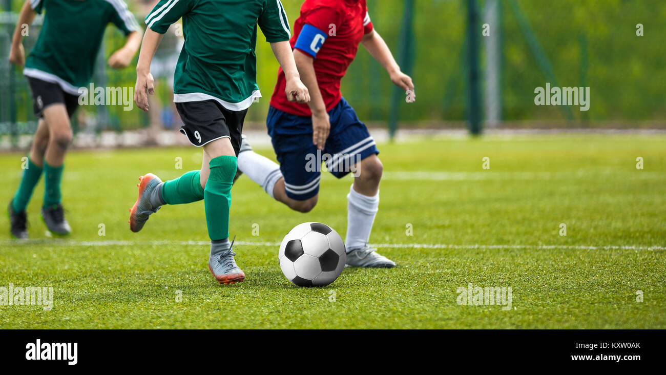 Football match for young players. Training and football soccer tournament for children. Youth soccer competition Stock Photo