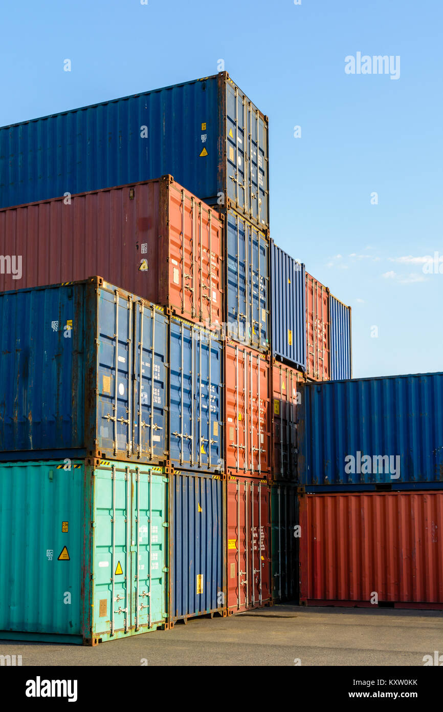 Dozens of dry cargo containers stacked in an intermodal terminal on the river Marne in the inner suburbs of Paris. Stock Photo