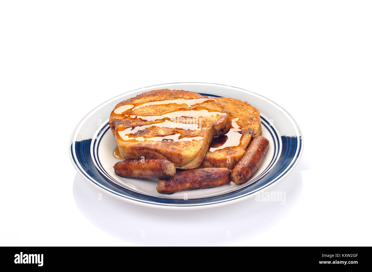 Breakfast blue plate special  of French Toast topped with maple syrup and sausages Stock Photo