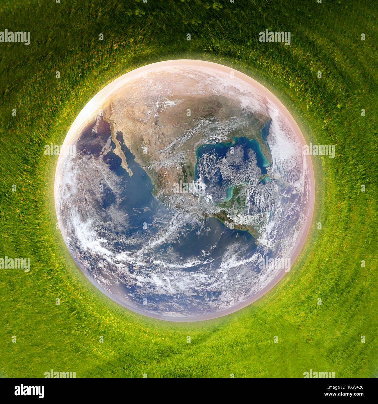 earth surounded by green grass, clean planet concept, earth day background - elements of this image are furnished by NASA Stock Photo