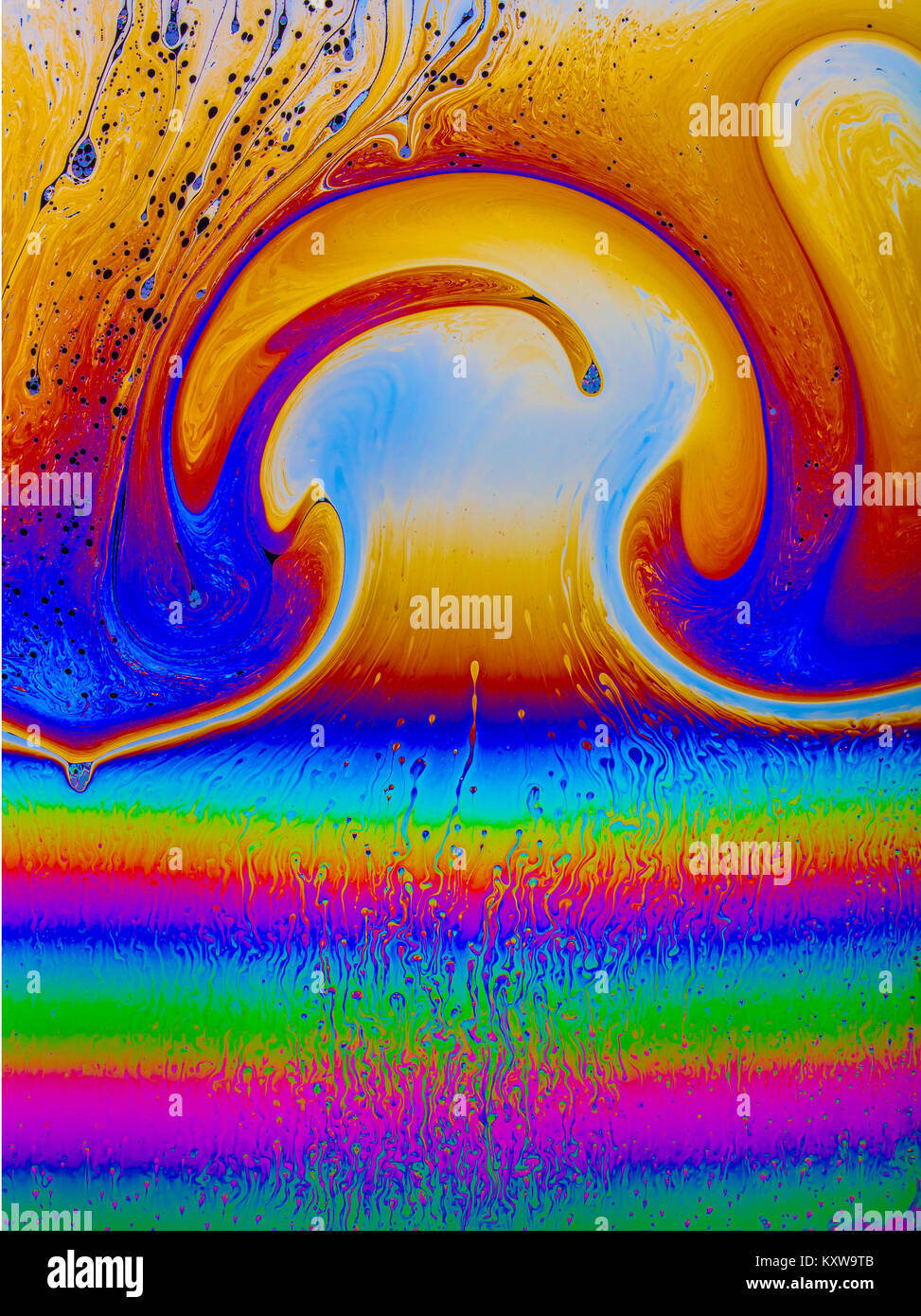 Optical thin film interference patterns in a stretched soap solution demonstrating  multi-colour, psychedelic, educational and artistic effects Stock Photo