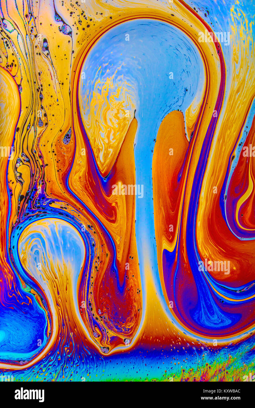 Optical thin film interference patterns in a stretched soap solution demonstrating  multi-colour, psychedelic, educational and artistic effects Stock Photo