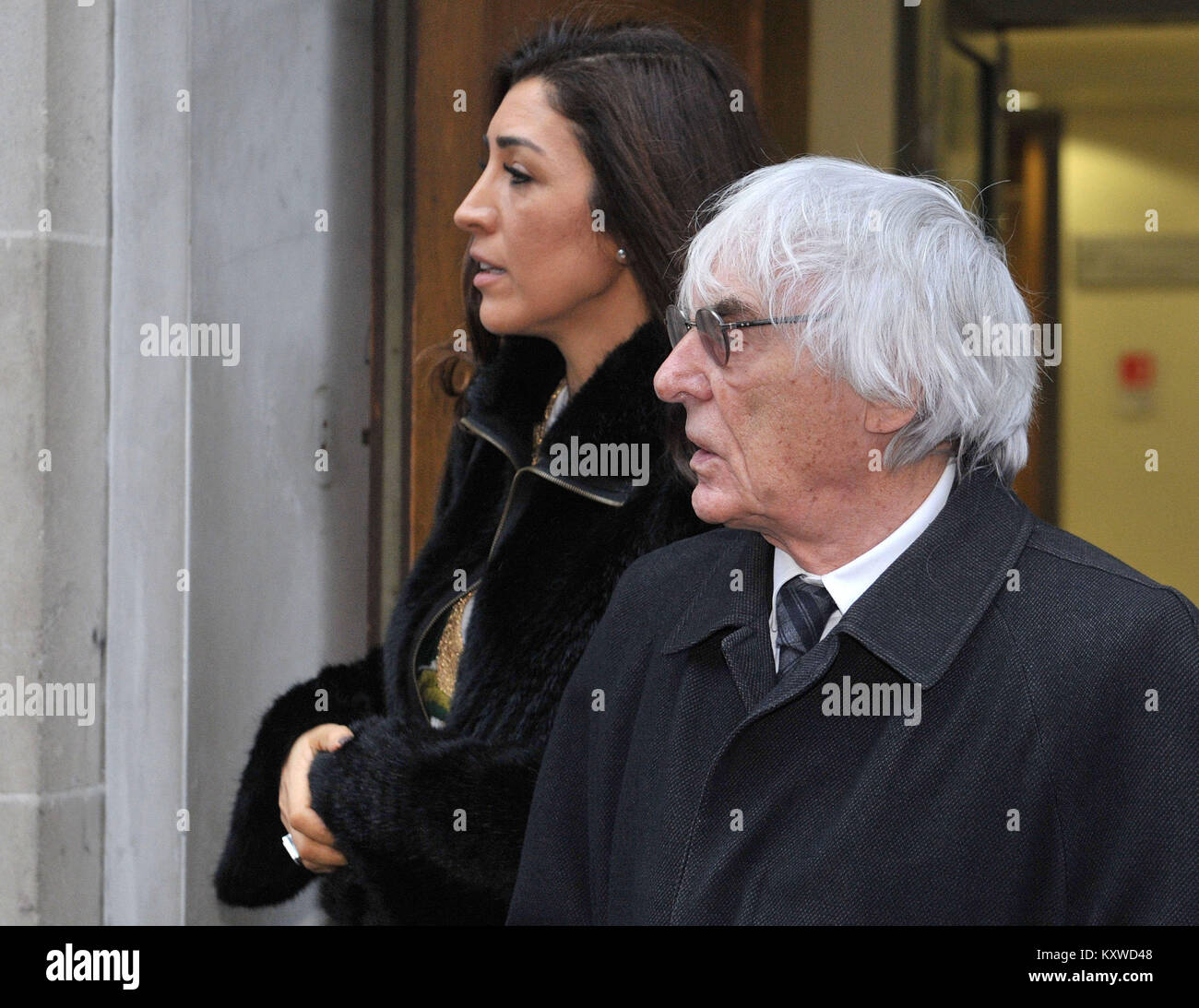 Tycoon Bernie Ecclestone and his wife Fabiana Flosi leaving London's Central Family Court, where his daughter Petra Ecclestone had the latest hearing in her divorce battle with ex-husband James Stunt. Stock Photo