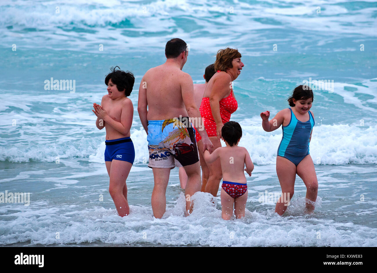 family having fun together in the sea at newquay, cornwall, england, britain, uk, Stock Photo