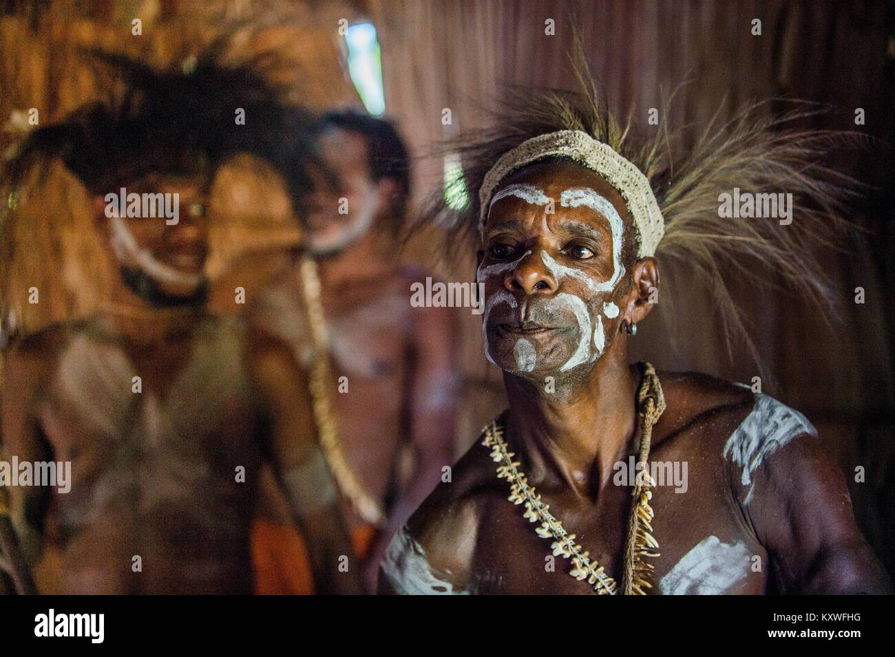 Portrait of a man from the tribe of Asmat people in the ritual face painting.  New Guinea. May 23, 2016 Stock Photo