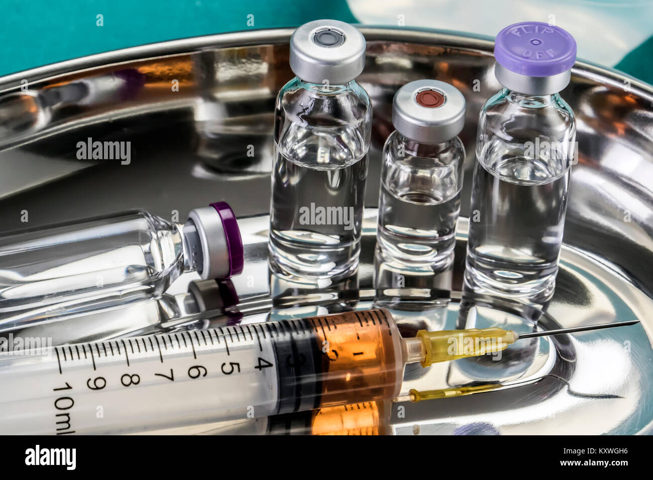 Some Vials And Syringe On Operating Table Stock Photo