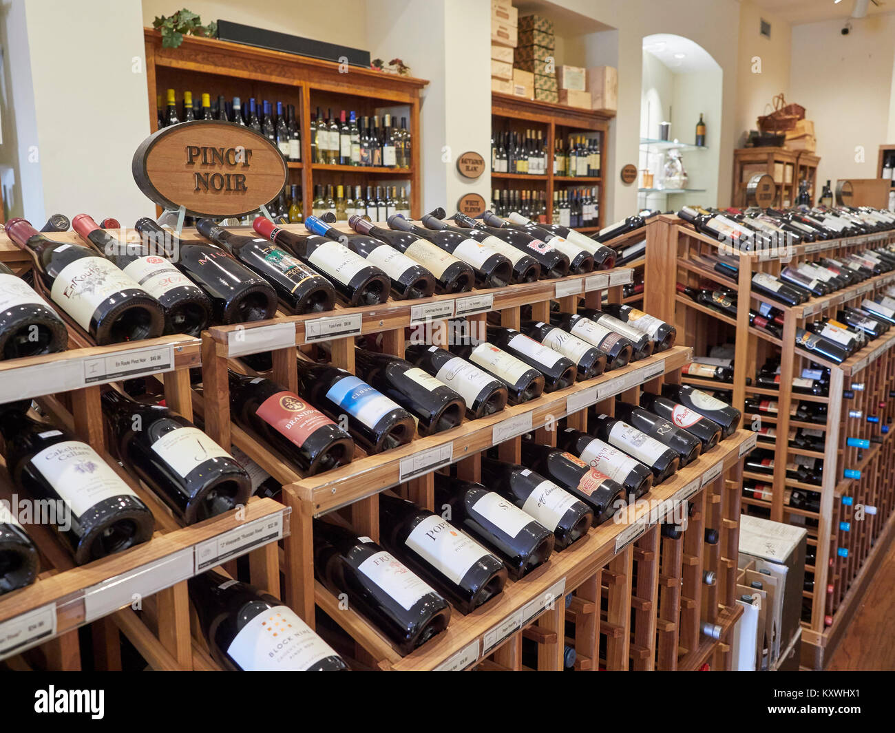 Wine shop shelves and shelving displaying many varieties of red and white wines for sale in Montgomery Alabama, United States. Stock Photo