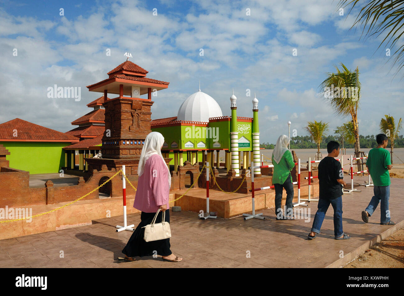 Malaysia Tourists Walk Past A Replica Of Menara Kudus Mosque Or Al Aqsha Mosque Java Indonesia At Islamic Heritage Park Kuala Terengganu Malaysi Stock Photo Alamy