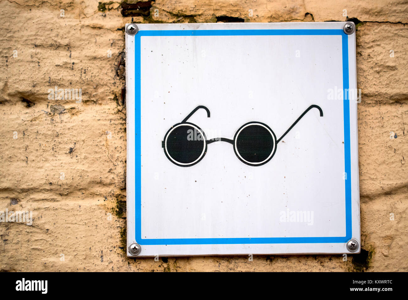 Visual disability sign on wall Stock Photo Alamy