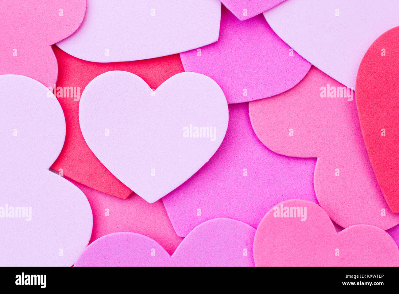 a-valentine-s-day-background-of-red-and-pink-love-hearts-or-heart-shapes-filling-the-frame-for-a