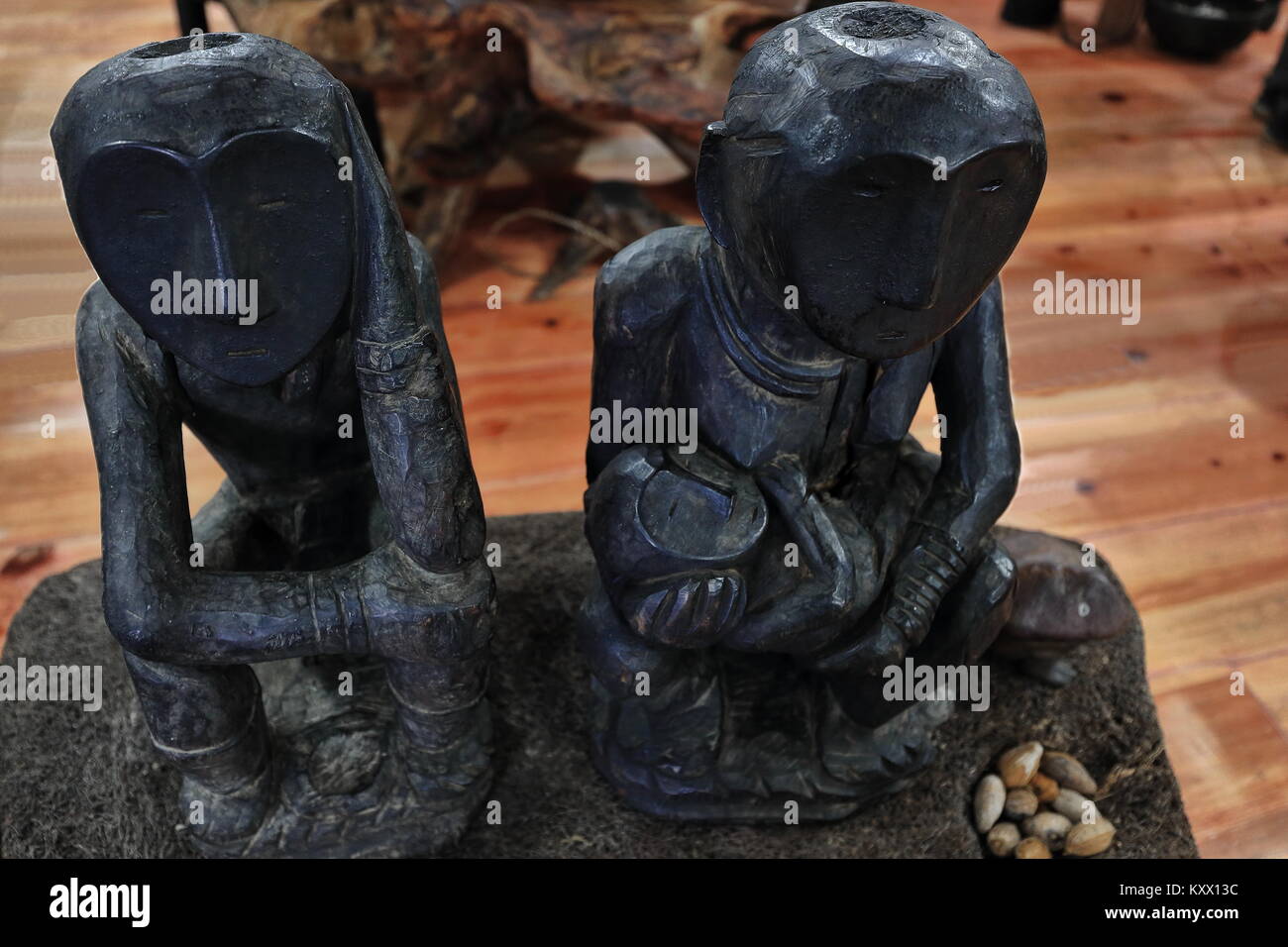 Banaue, Philippines-October 6, 2016: The Museum of Cordilleran Sculpture shows the art of the Cordillera region.s peoples and cultures. Couple of bulu Stock Photo