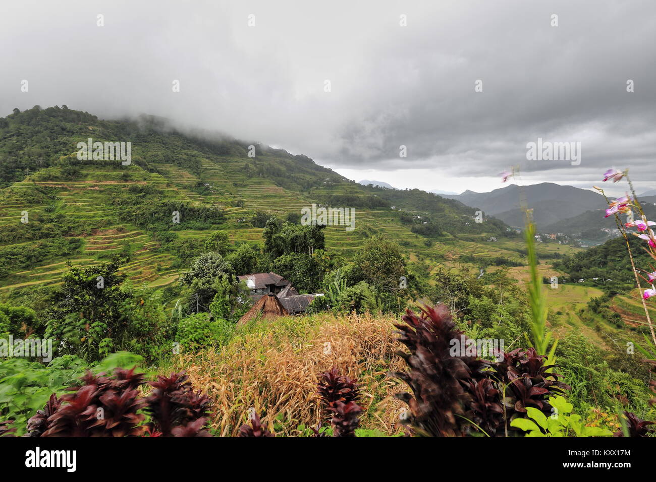N-wards view from the Museum of Cordilleran Sculpture to rice terraces over Banaue downtown after heavy rainstorm under menacing cloudy sky. Ifugao pr Stock Photo