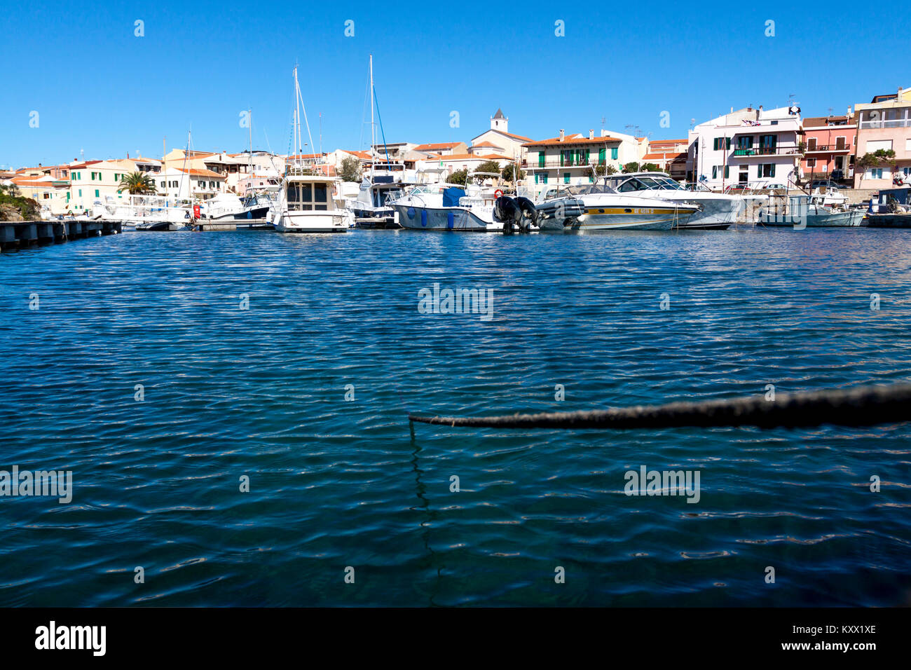 Rope that moorage the dock. Stintino, Sardinia. Italy Stock Photo