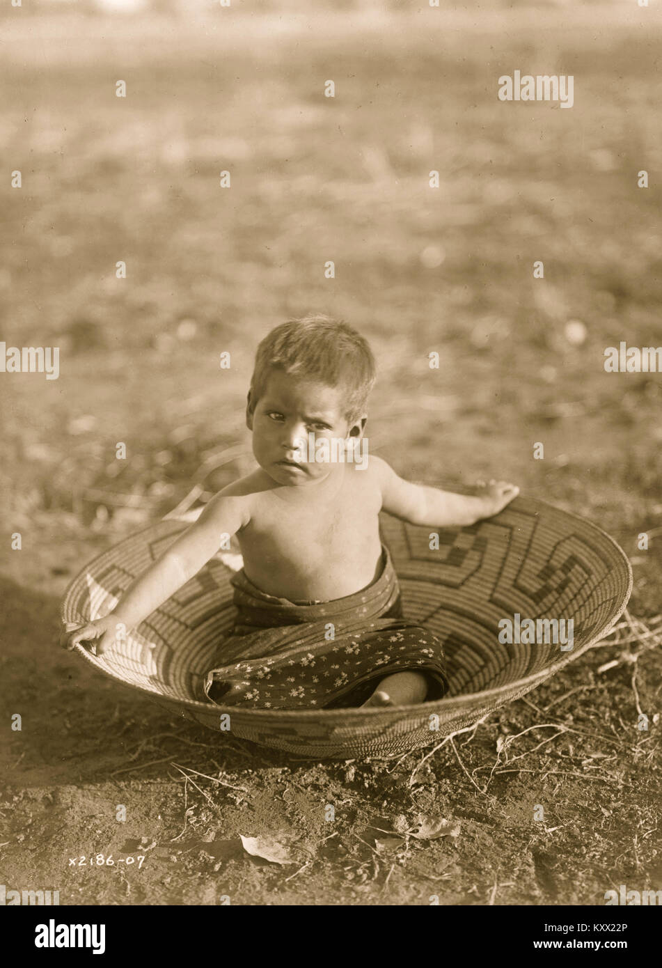 Toddler in Basket Stock Photo