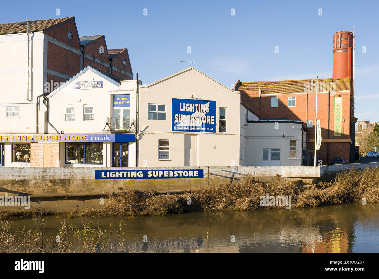 Lighting Superstore is one business now operating from a former wholesale dairy plant beside the River Avon in Melksham Wiltshire England UK Stock Photo