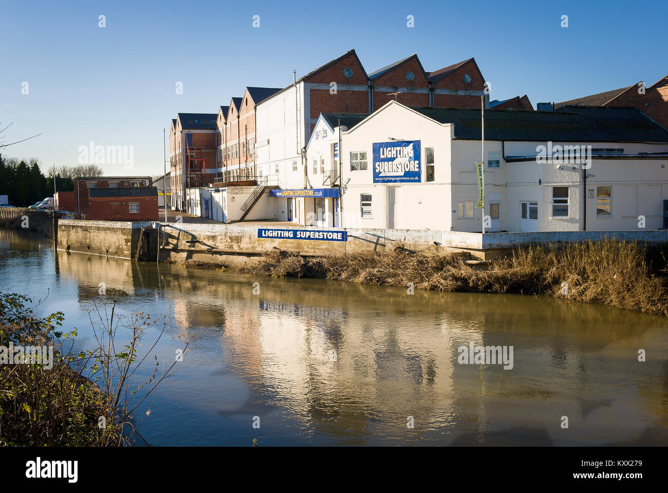 Located beside the River Avon is a former wholesale dairy factory which now houses smaller businesses in Melksham Wiltshire England UK Stock Photo
