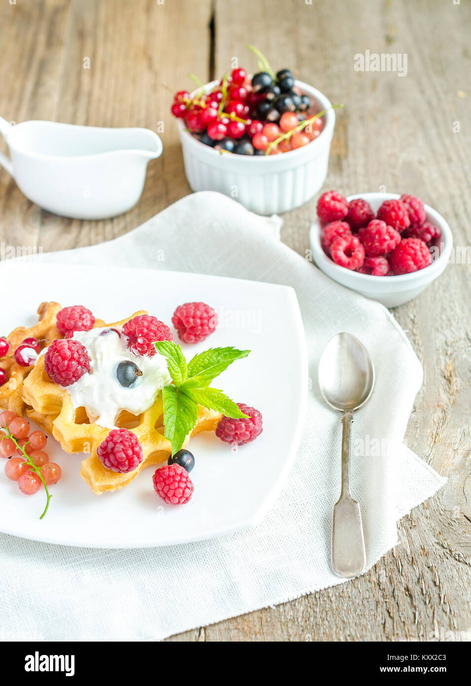 Belgian waffles with whipped cream and fresh berries Stock Photo - Alamy