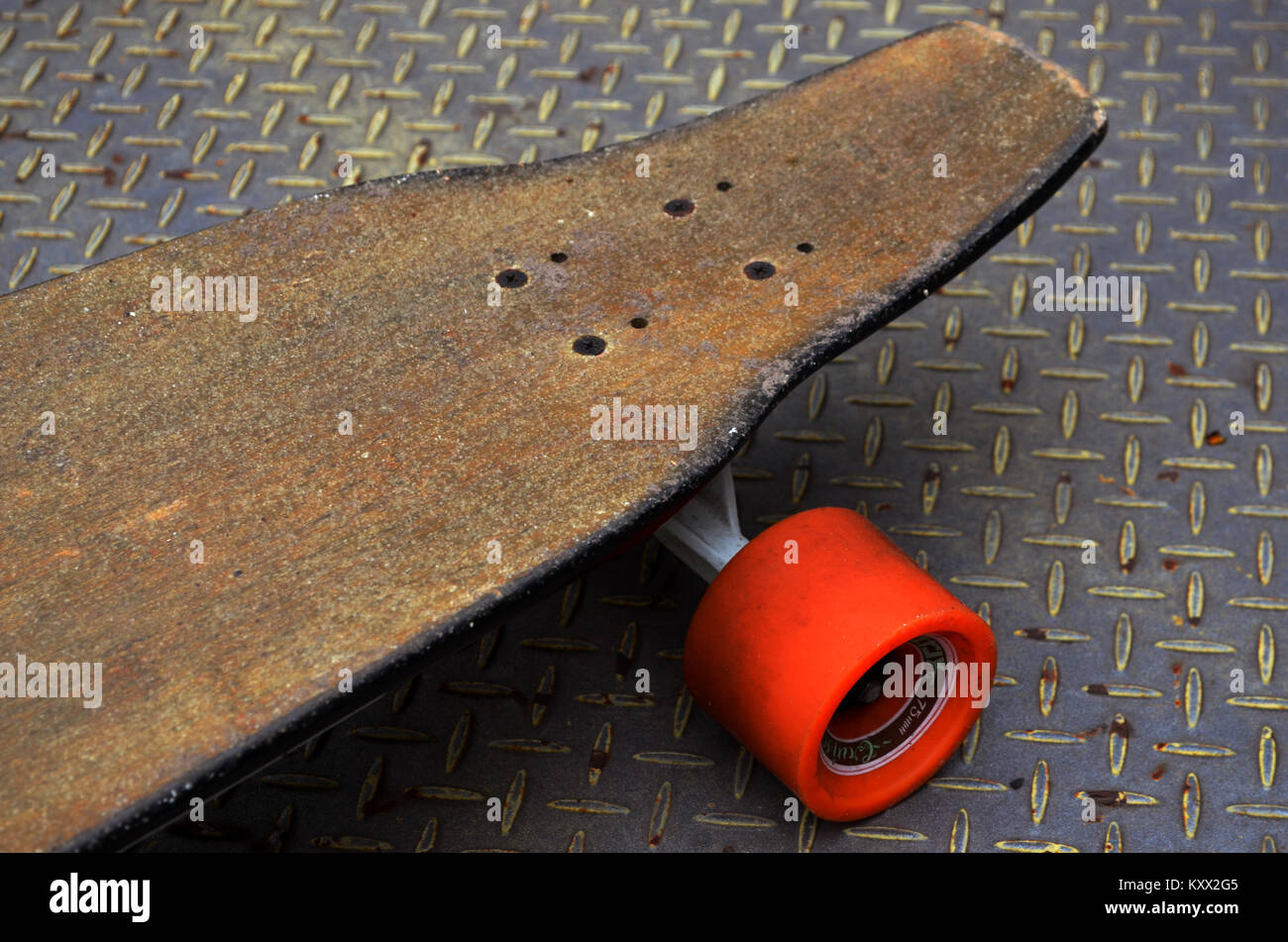 Longboard skateboard on metal backdrop Stock Photo