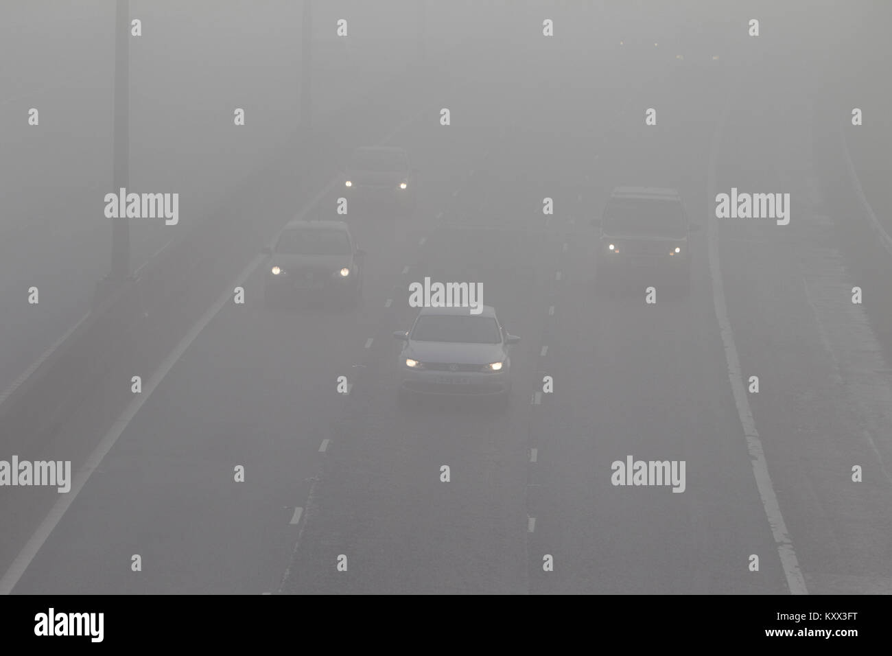 Cars with headlights on in daytime uk hires stock photography and