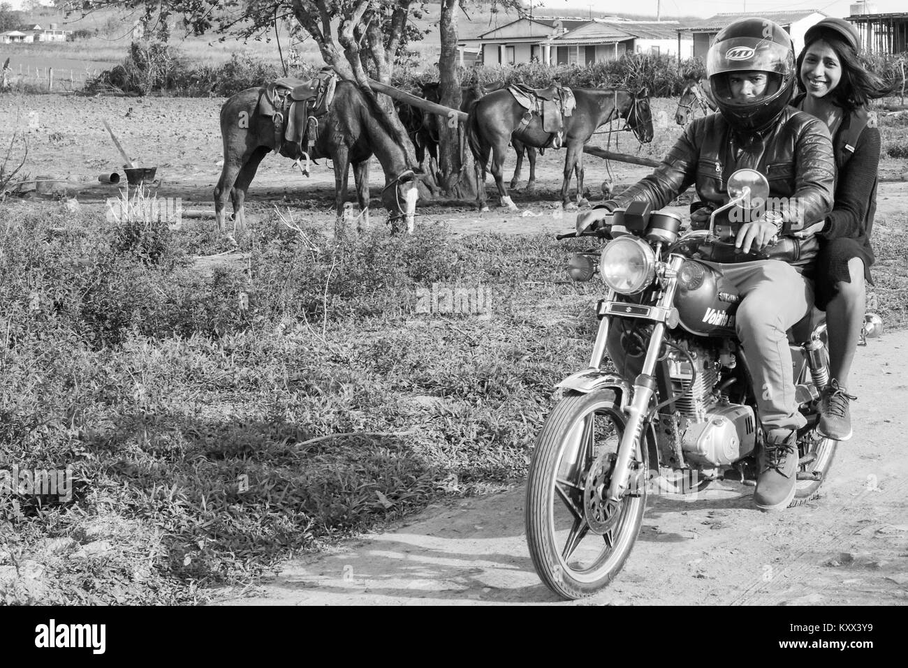 Young Cubans riding a motorcycle, Pinar Del Rio, Cuba Stock Photo