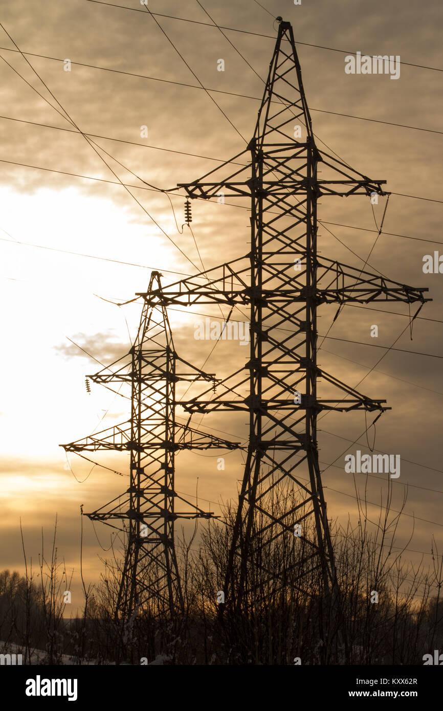 Silhouette High voltage electric tower on sunset time and sky Stock ...