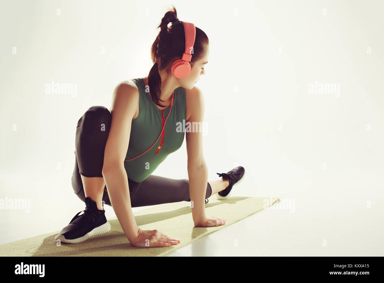 Front view of a young woman stretching body in gymnastics class Stock ...