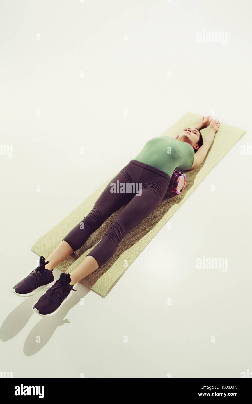 Front view of a young woman stretching body in gymnastics class Stock ...
