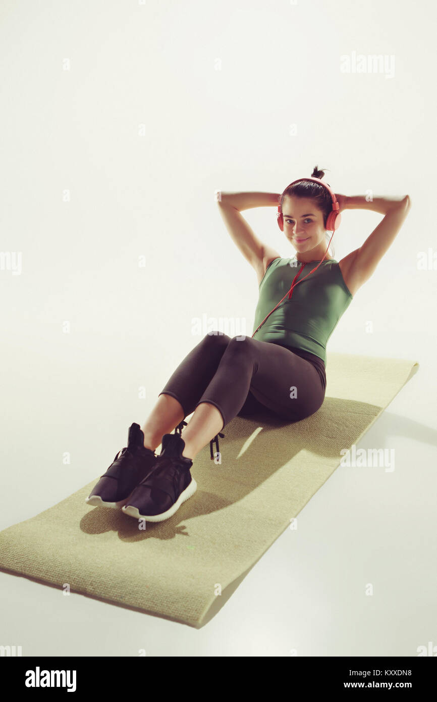 Front view of a young woman stretching body in gymnastics class Stock ...