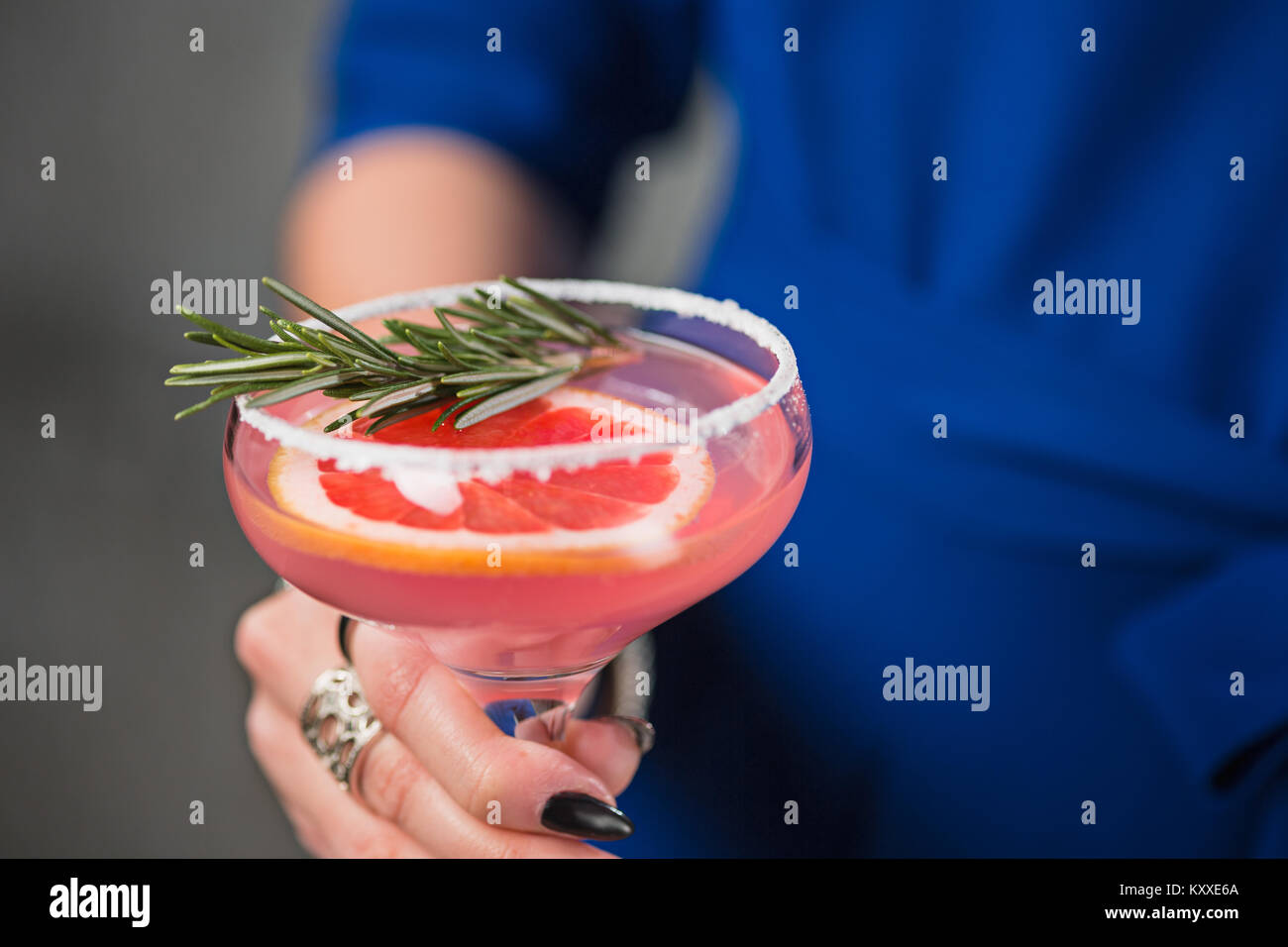 The exotic cocktail and female hands Stock Photo