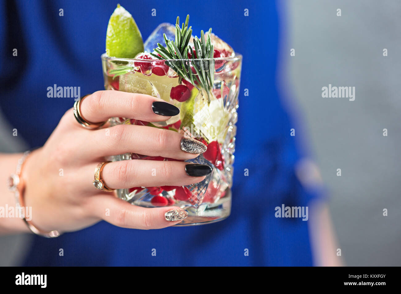 The exotic cocktail and female hands Stock Photo