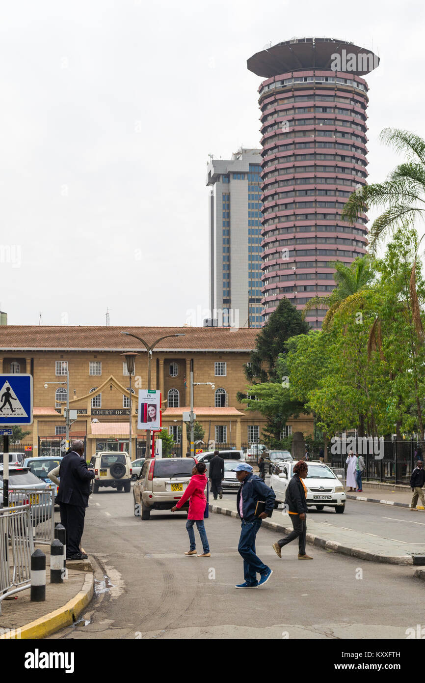 View down Wabera Street towards Kenyatta International Conference Centre with people going about daily life, Nairobi, Kenya Stock Photo