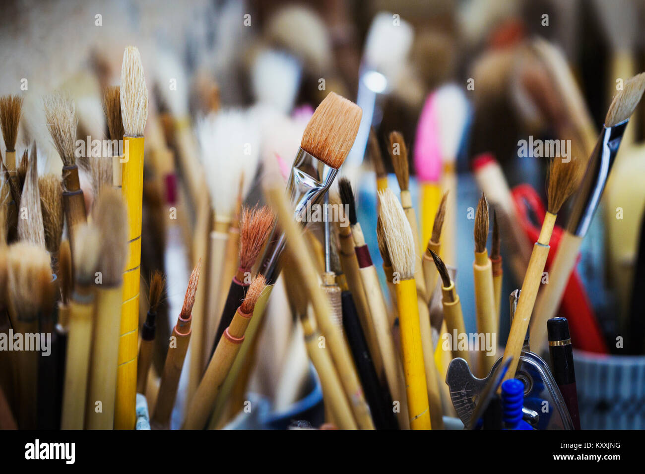 Close up of a selection of paintbrushes in a Japanese porcelain
