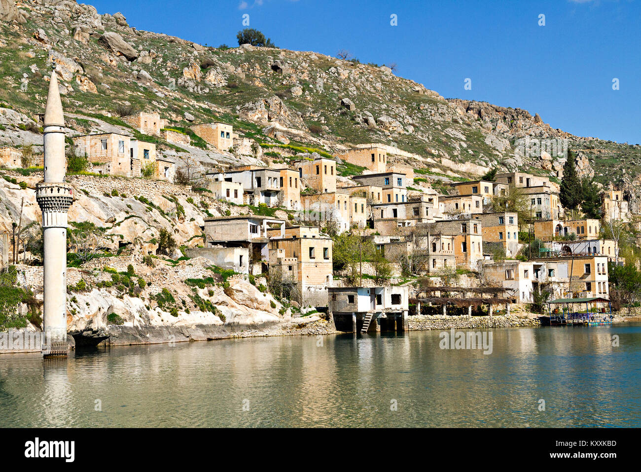 Ruins of the town Halfeti after it remained under the reservoir of a dam built on the River Euphrates, in Sanliurfa, Turkey Stock Photo