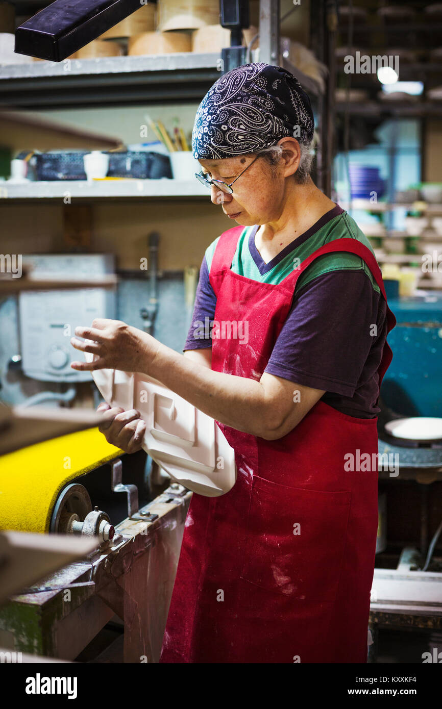 Asian senior woman wearing apron hi-res stock photography and images ...