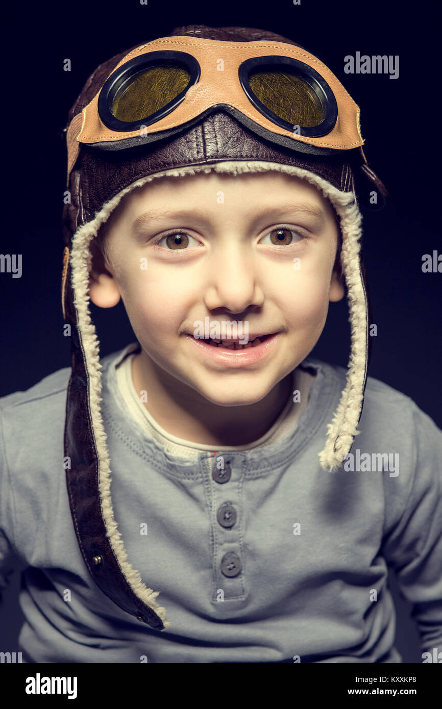 portrait of caucasian child play to be an aviator Stock Photo