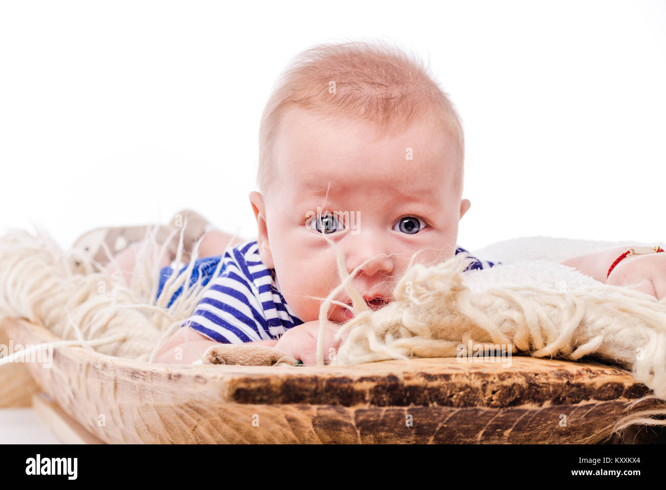 Adorable baby boy with big blue eyes over white background Stock Photo