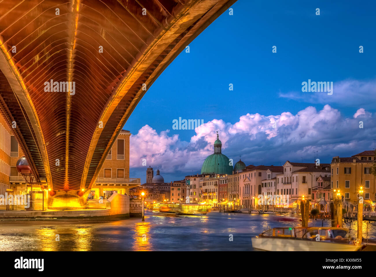 The Grand Canal and pedestrian bridge at Piazzale Roma at night in Veneto, Venice, Italy, Europe. Stock Photo