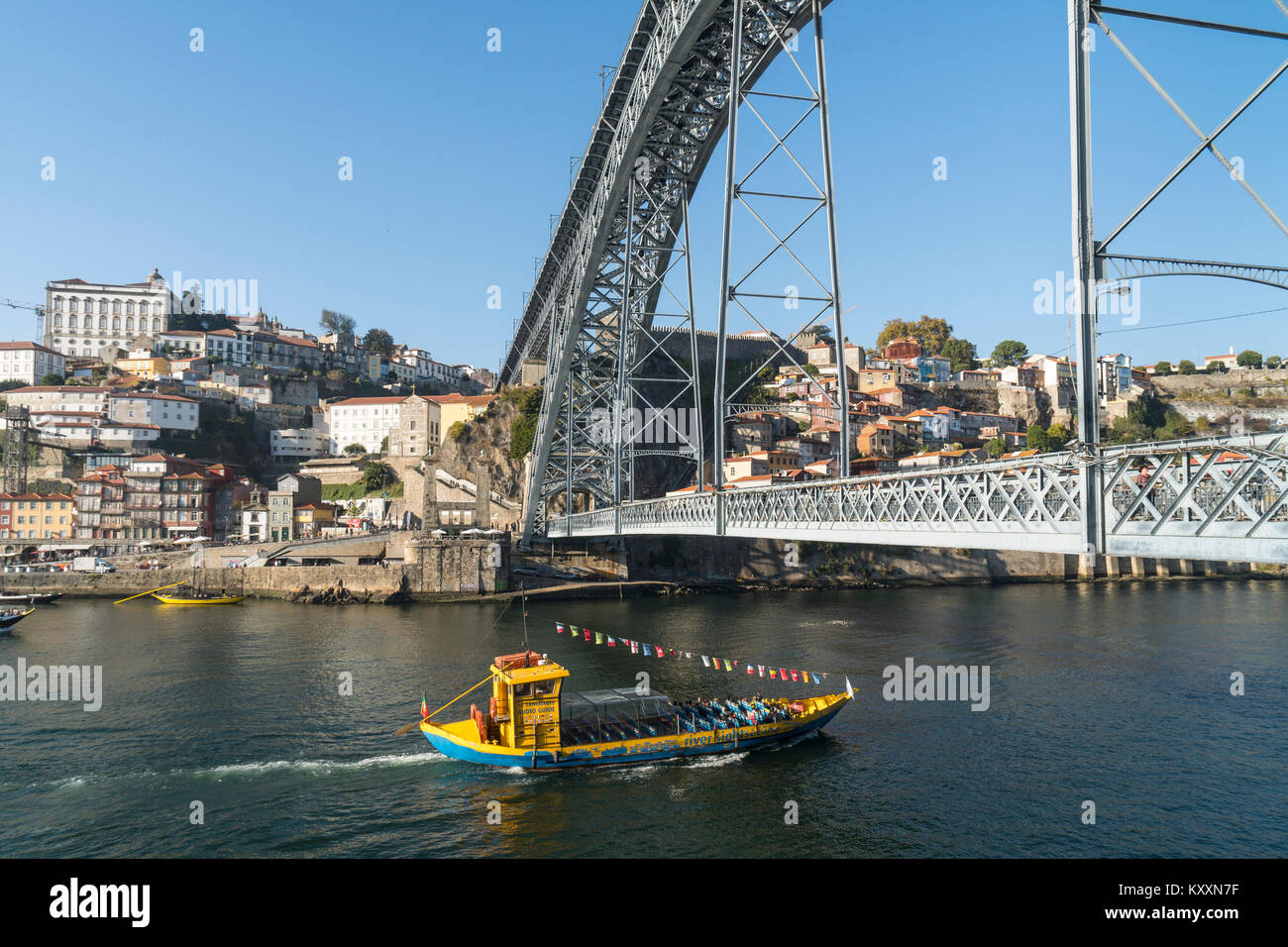 the River Douro waterfront looking towards the Ribeira district of Porto, Portugal. with the Dom Luis I Bridge in the foreground. Stock Photo