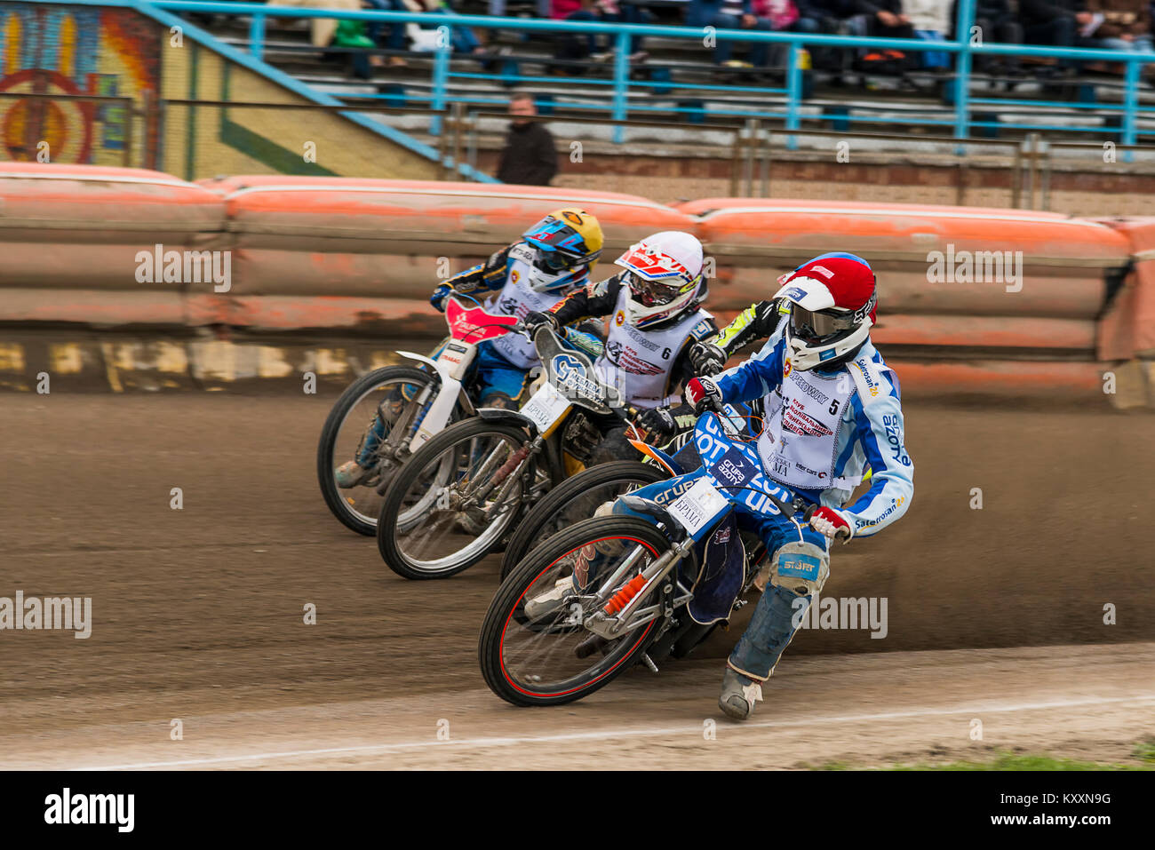 Rivne, Ukraine - 11 Oktober 2015: Four unknown riders overcomes the track at the Open Cup Speedway to the day of the city Rivne Stock Photo