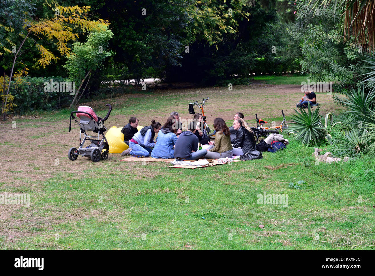 Family and friends meeting and relaxing in Greek National Garden, Athens, Greece Stock Photo