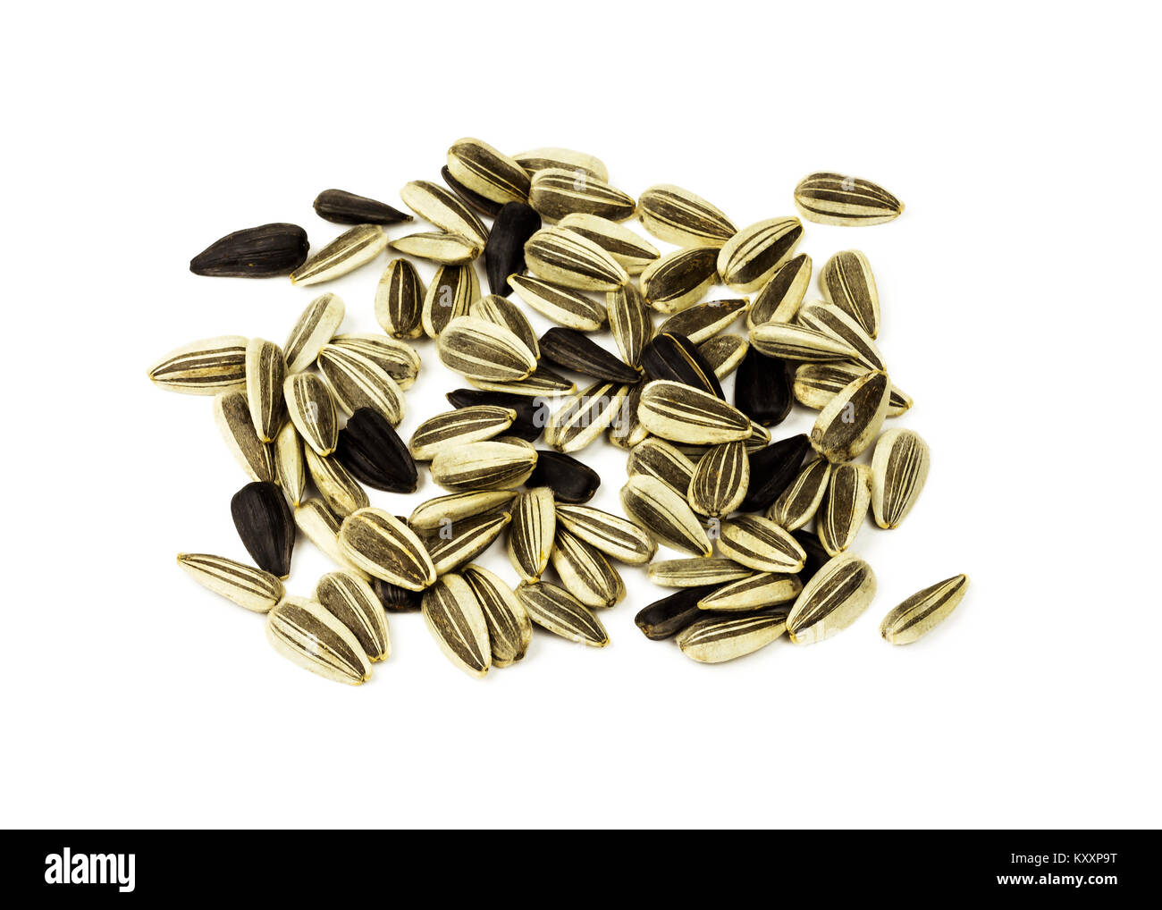 On a white background are white and black sunflower seeds, close-up ...