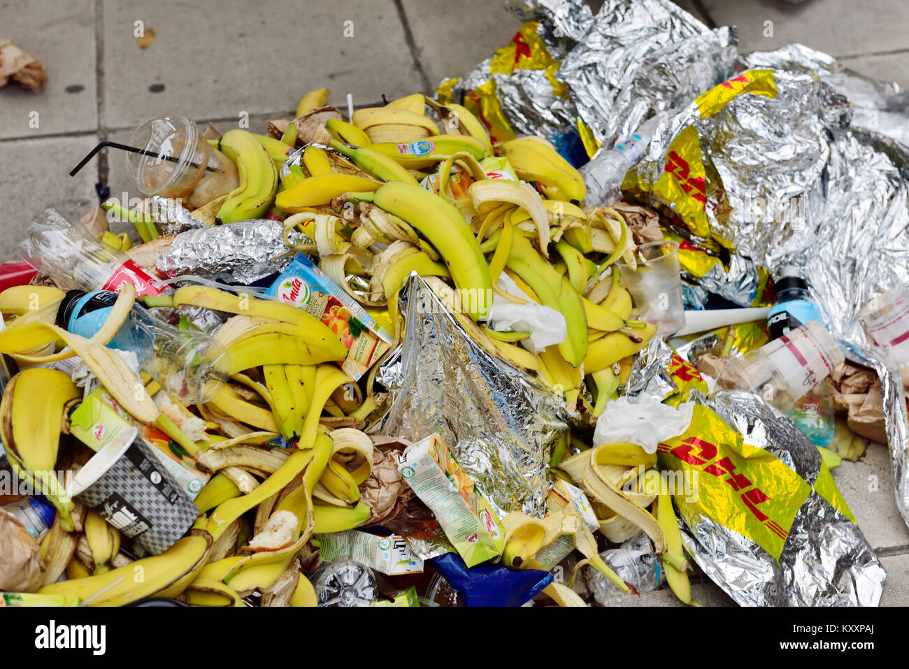Banana peals, thermal foil sheets, drinks discarded after runners finish marathon race Stock Photo